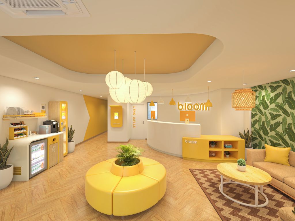 A reception area with a counter, seating, and a wall with a leafy pattern.