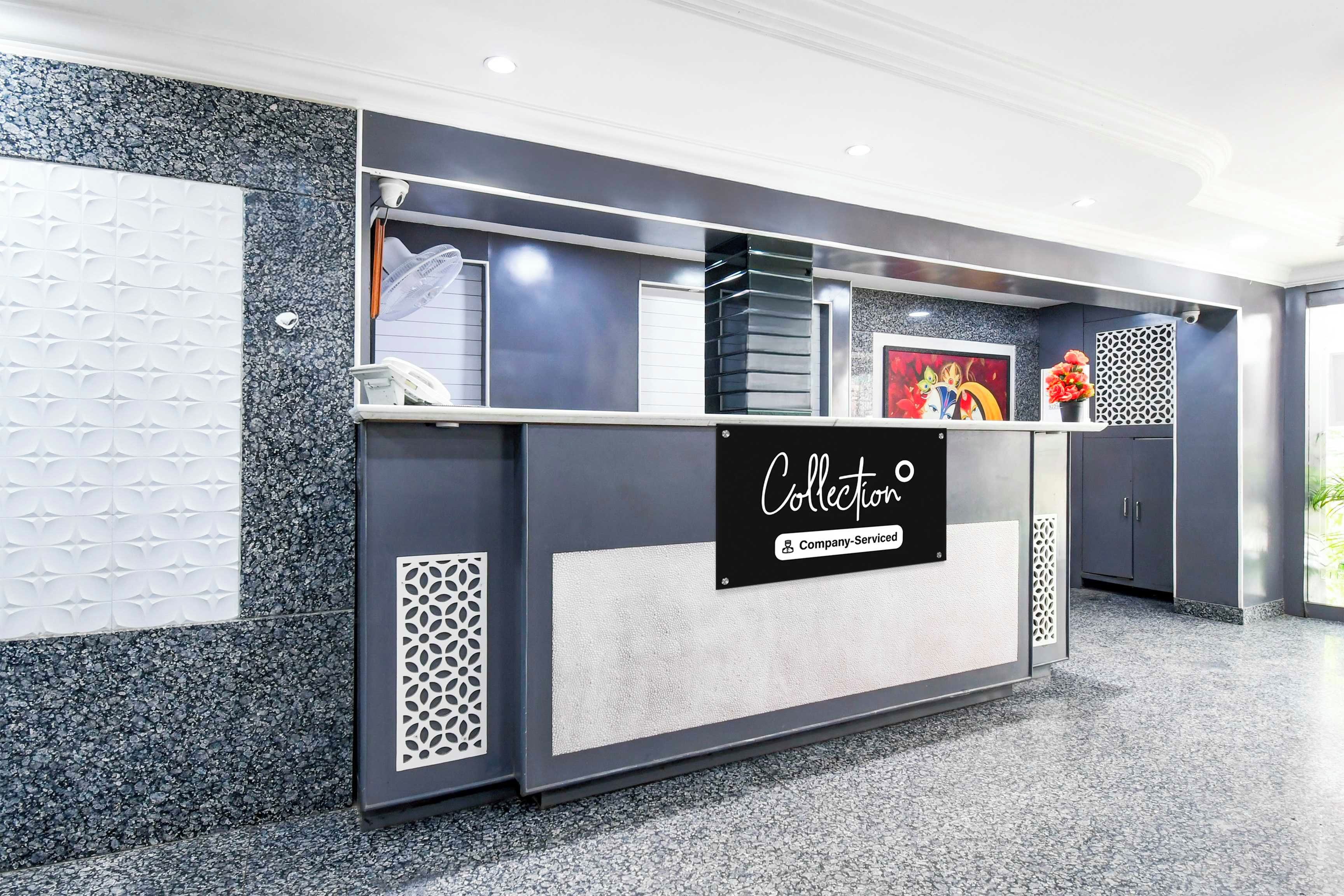 A reception desk with a sign that reads 'Collection Company-Serviced'.