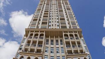 A tall hotel building with a sign reading 'Bonnour Hotel.'