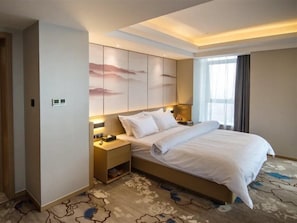 A hotel room with a large bed, bedside tables, a wall-mounted TV, and a window with curtains. - Metropolo Jinjiang Hotels (Xuzhou)