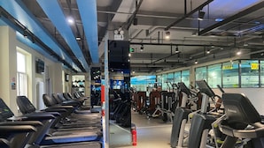 A gym with treadmills, weight machines, and exercise equipment. - Lavande Hotel (Beijing)
