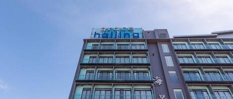 A multi-story building with a sign that reads 'grace halting.'