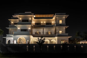 A multi-story building with a modern architectural design, featuring balconies and large windows. - House of Jasol by DanCenter, Jaipur (Jaipur)