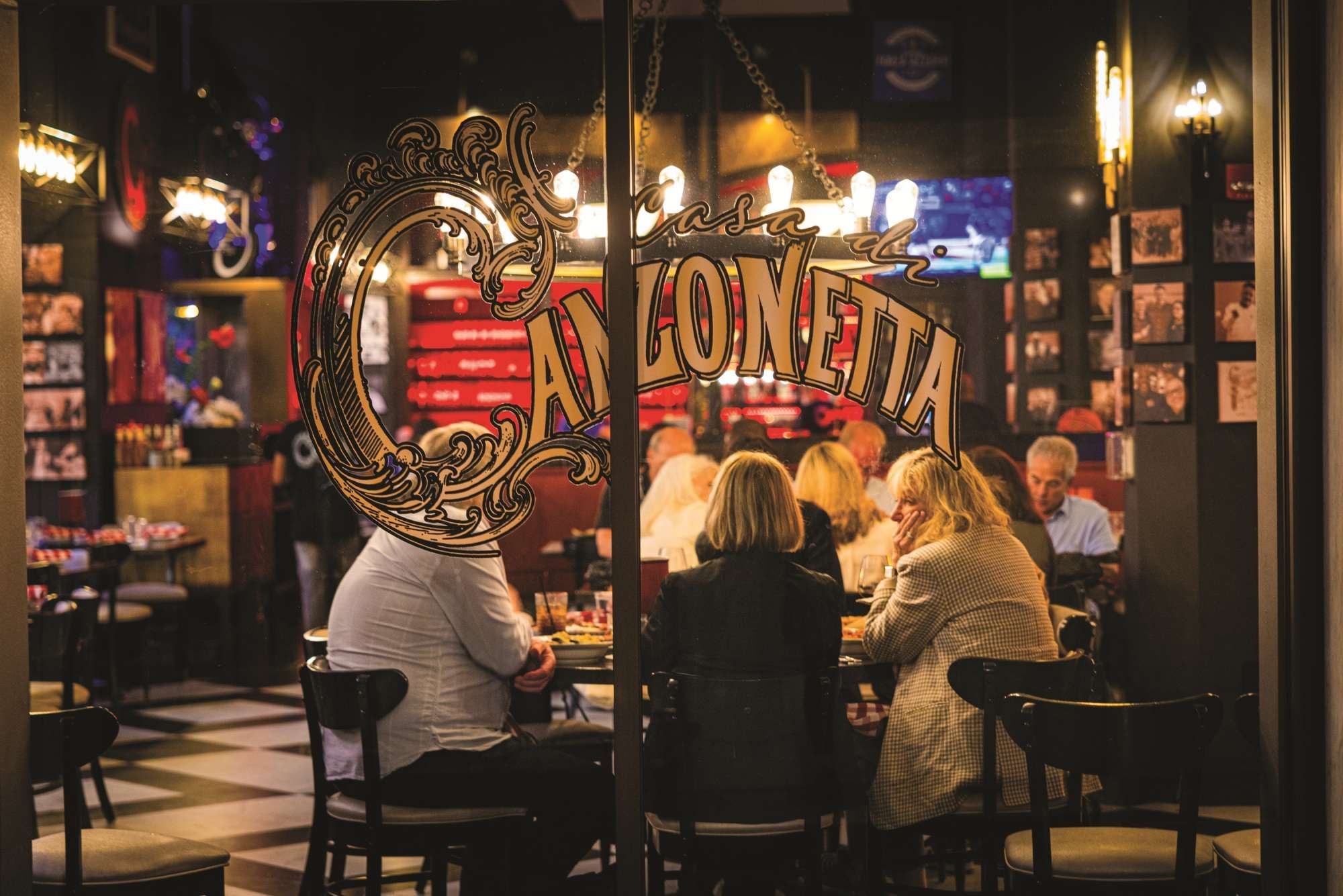 An interior view of a restaurant with a large decorative sign reading 'Casa Coneta.'
