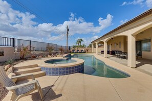 A pool area with a hot tub, lounge chairs, and a covered patio with seating. - Mtn Views, Hot Tub! Extended Lake Havasu Escape (Lake Havasu City)