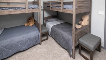 A bunk bed room with a dog and a stuffed rabbit toy.