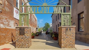 A street entrance with a sign reading 'LOVEJOY WAY' and two plaques on either side. - Walkable Main Street Apartment in Princeton! (Princeton)