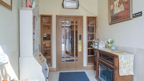 A hotel lobby with a reception desk, a fireplace, and a door leading to the rooms. - Walkable Main Street Apartment in Princeton! (Princeton)