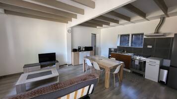 A modern kitchen with a microwave, stove, and sink.