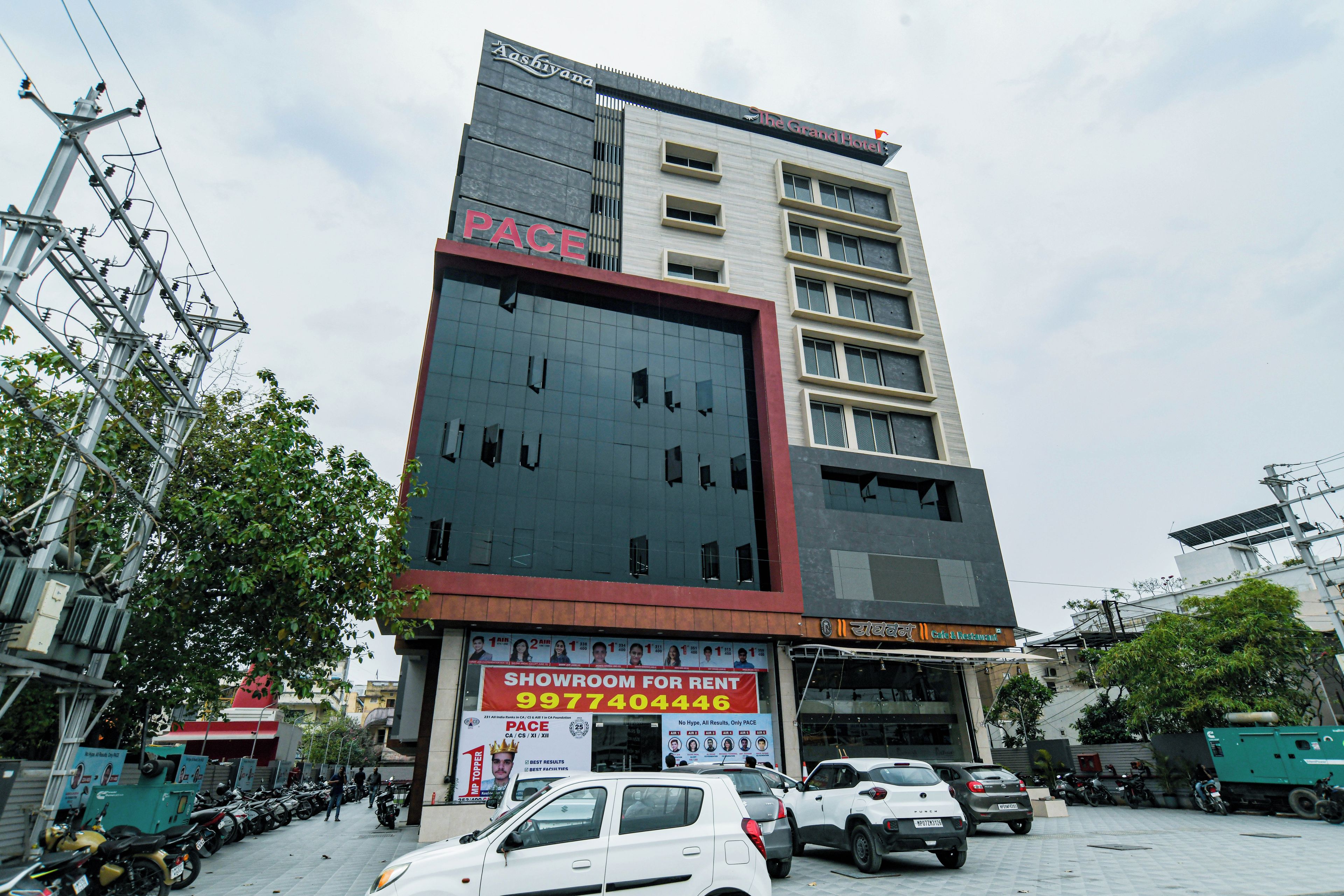 A multi-story building with a prominent 'PACE' sign on the facade, indicating a commercial space.