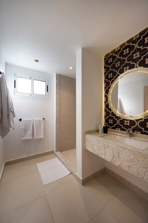 A modern bathroom with a large mirror, a towel rack, and a shower area. - Specail offer at Western by Spacey #10 (Cairo)