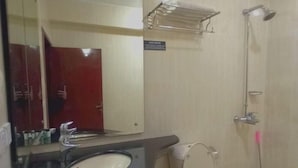 A bathroom with a sink, toilet, and shower. - Shangrila Hotel & Resort Changla Gali (Abbottabad)