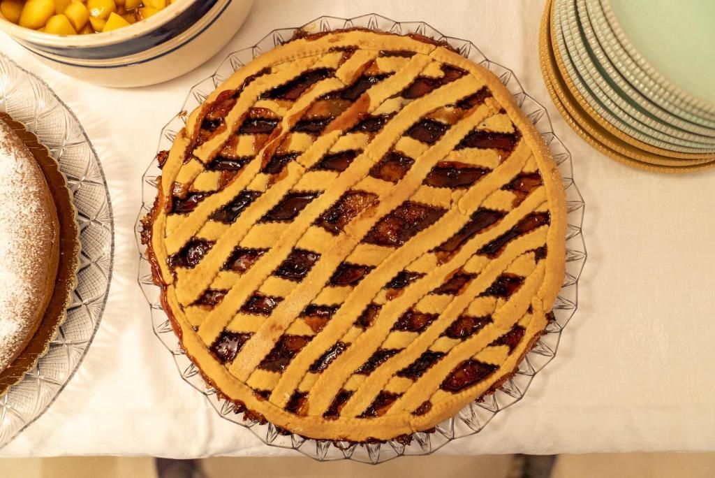 A pie with a lattice crust on a plate.