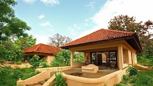 A villa with a patio, outdoor seating, and a swimming pool. - Tuli Tiger Corridor (Barghat)