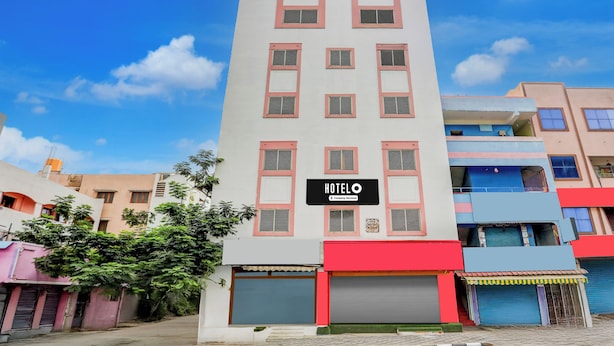A hotel building with a sign indicating it is company-serviced. - OYO Hotel O Karakambadi Near Alipiri (Tirupati)