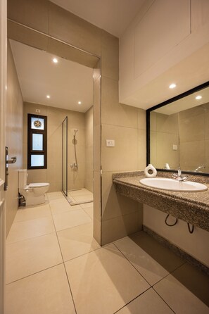 A modern bathroom with a shower, toilet, and sink. - perfect stay at Mexican by Spacey #12 (cairo)