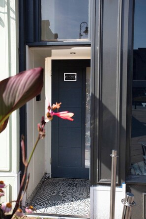 A black door with a sign indicating 'Apartments 1-4 Biulayah House 11 Biulayah Street Mandurah QLD 6170'. - Harrogate's Most Central Apartments - Sleeps 12 (Harrogate)