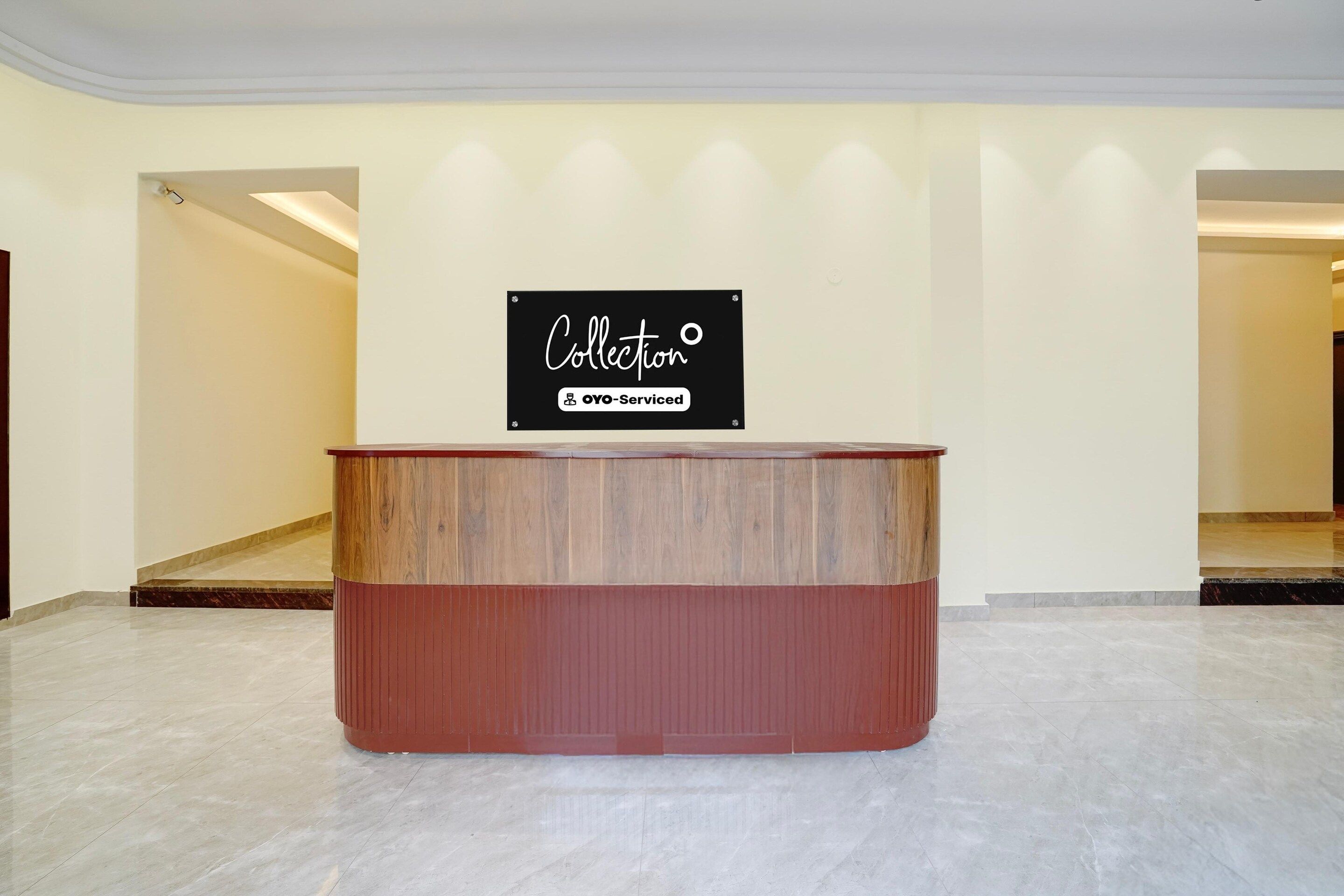 A reception desk with a sign above it.