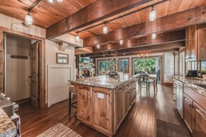 Your kitchen opens to a the living and dining area—the ideal gathering space for cooking, sharing stories, and unwinding together. - Dog-Friendly Tahoe Family Home | Tahoma (Tahoma)