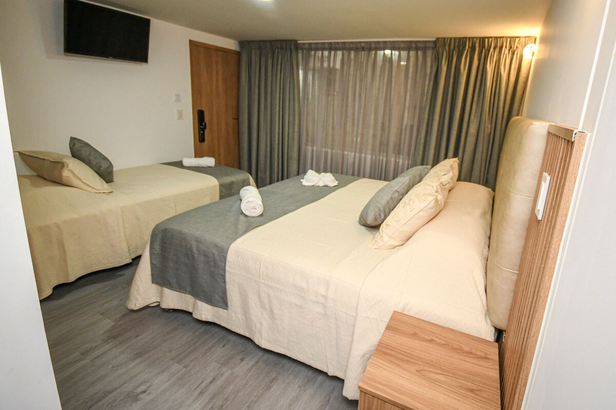 Habitación triple superior, vista al jardín