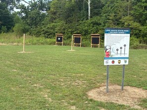 A sign for Lake White State Park Archery Range with range rules and a target display. - Cozy Family-Friendly 2-Bedroom Lakeview Retreat in Waverly, OH with AC (Waverly)
