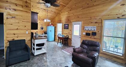 Charming two-bedroom cabin offers a private retreat surrounded by nature.
