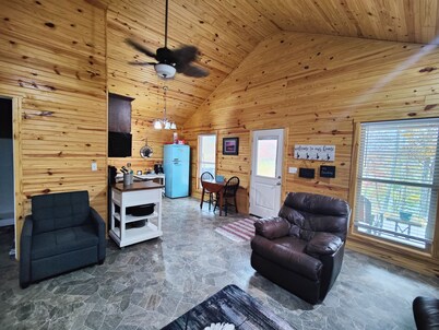 Charming two-bedroom cabin offers a private retreat surrounded by nature.