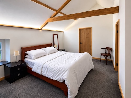 Luxury converted barn with hot tub on a farm