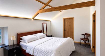 Luxury converted barn with hot tub on a farm