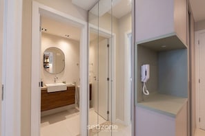 A modern bathroom with a glass-enclosed shower, a wooden vanity, and a mirror. - Apt. in Condo. w/ Pool nr. 150m Beach Nau0409 (Salvador)