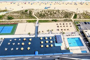 A resort with a beach, a pool, and a tennis court. - Golden Sands 1611111 (Ocean City)