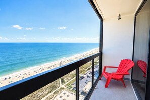 A balcony with a view of a beach and ocean. - Golden Sands 1611111 (Ocean City)