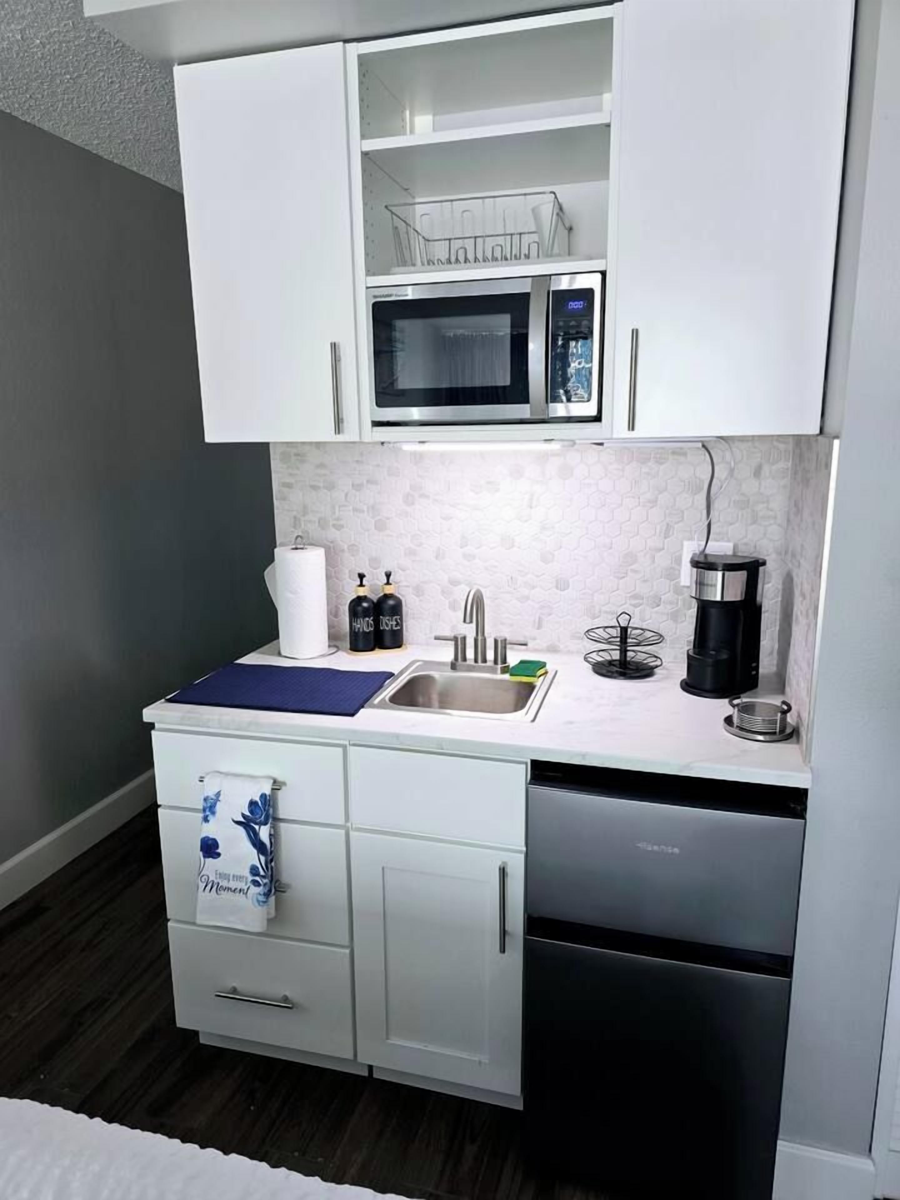 Coffee/tea maker, microwave, toaster, cookware/dishes/utensils