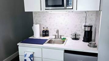 Coffee/tea maker, microwave, toaster, cookware/dishes/utensils