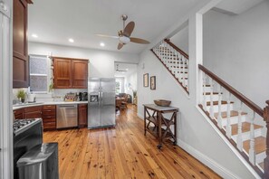 A modern kitchen with wooden cabinets, stainless steel appliances, and a central island. - NEW! Benton Park Gem, Sleeps 8 & Dog Friendly - Stay Smiley Rentals (St. Louis)