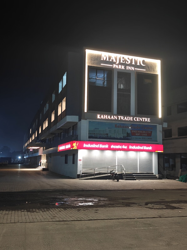 A building with a prominent sign for 'MAJESTIC PARK INN' and 'KAHAAN TRADE CENTRE' below.
