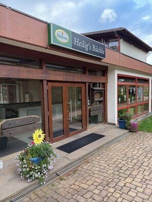 A building with a sign reading 'Heilig's Bäckle' and a logo for 'Waldhaus'. - Schluchsee Dream in the Black Forest (Schlochsee)