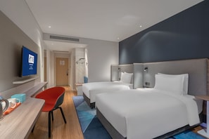 A hotel room with two beds, a desk with a chair, a television, and a bathroom with a shower. - Holiday Inn Express Lanzhou New Area an IHG Hotel (Lanzhou)