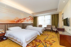 A hotel room with two beds, a flat-screen TV, a desk, and a large mural on the wall. - The BLD International Hotel (Dongguan)