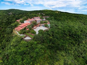 A hotel with multiple buildings on a hillside, surrounded by dense greenery. - Fountain Mahabaleshwar Ihcl Seleqtions (Mahabaleshwar)