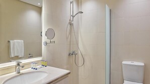 A modern bathroom with a sink, mirror, and shower. - Nur Al Naseem by Makarem (Makkah)