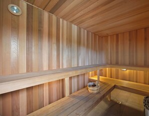 A sauna with wooden walls and benches. - Gold Coast central, fabulous golf course resort, near beach, shops, restaurants (Clear Island Waters)
