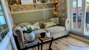 Quarto casal ou duplo família, vista para o jardim | Área de estar