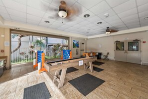 A lobby with a pool table, ceiling fans, and a view of the outside. - ¼ mile to Kam I Beach, Renovated 3BR Resort apt (Kihei)