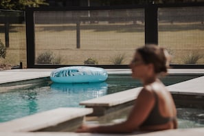A swimming pool with a blue inflatable float. - The Wellness Farm Grateful Villa 3 (Broke)