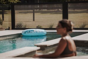 A swimming pool with a blue inflatable float. - The Wellness Farm Peace Villa 2 (Broke)