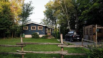 A house with a front porch, a garage, and a driveway.