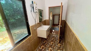 A bathroom with a shower, sink, and mirror. - Kood Life !  1-bedroom   JUNGLE SUITE with AC in charming Ko Kut (ko kut)