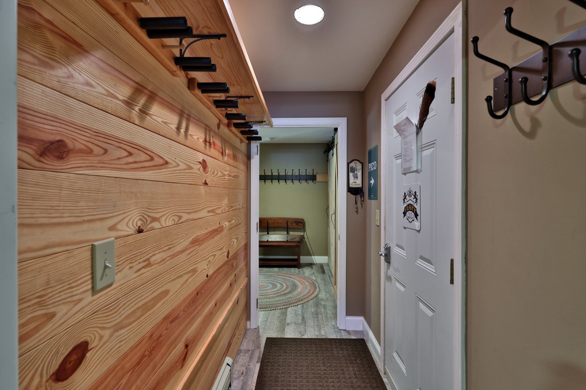 Leave coats on the entry hooks before heading into the living area.