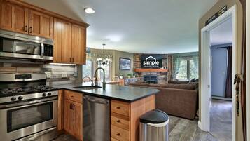 The kitchen opens to the living room, so whoever is cooking can still join the conversation.